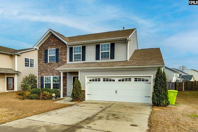 view of front of property featuring a front lawn and a garage