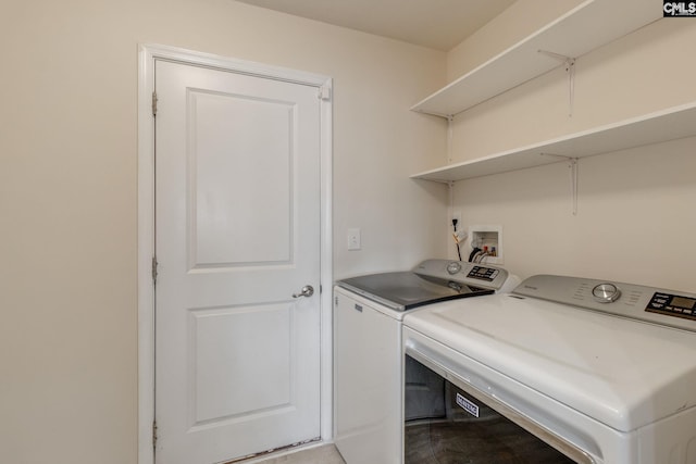 laundry area with washing machine and clothes dryer and hookup for a washing machine