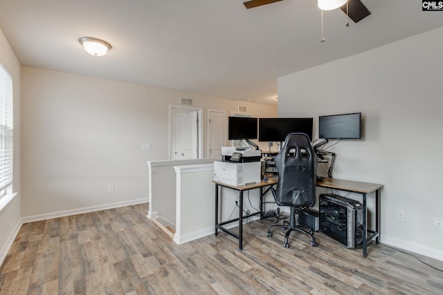 home office featuring ceiling fan and light wood-type flooring