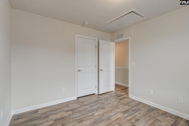 unfurnished bedroom with light hardwood / wood-style flooring