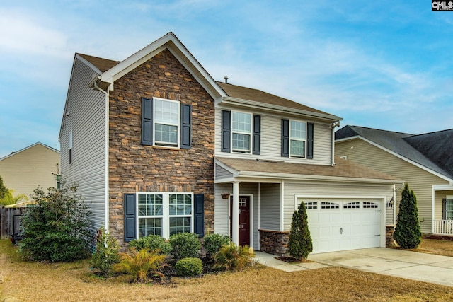 view of front of property with a front lawn and a garage