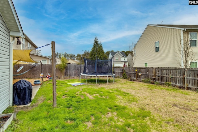 view of yard with a trampoline