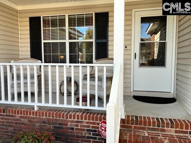 entrance to property with covered porch