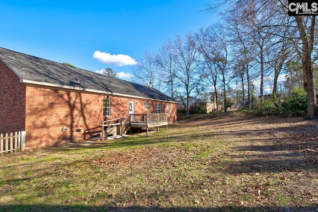 view of yard with a wooden deck