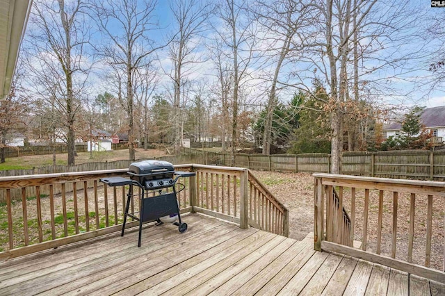 wooden deck featuring grilling area