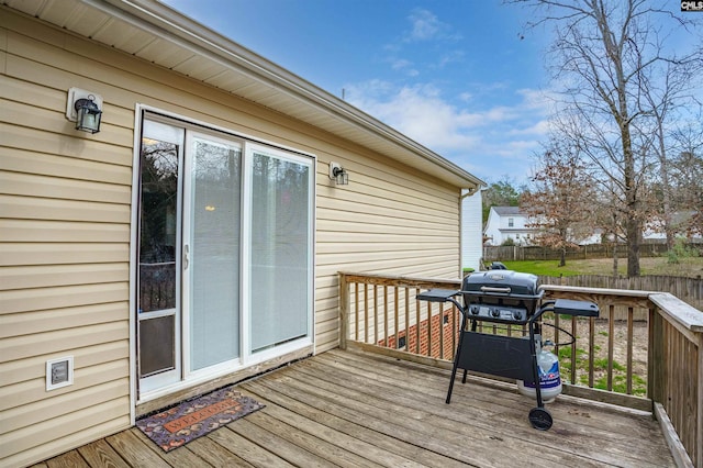 wooden deck featuring area for grilling