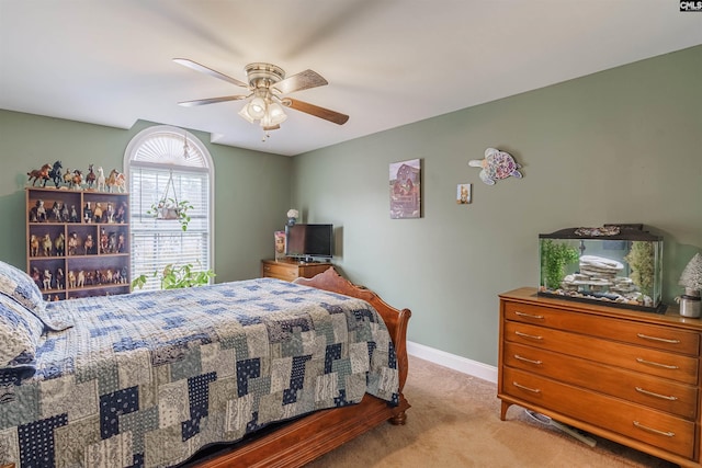 bedroom featuring ceiling fan and light colored carpet