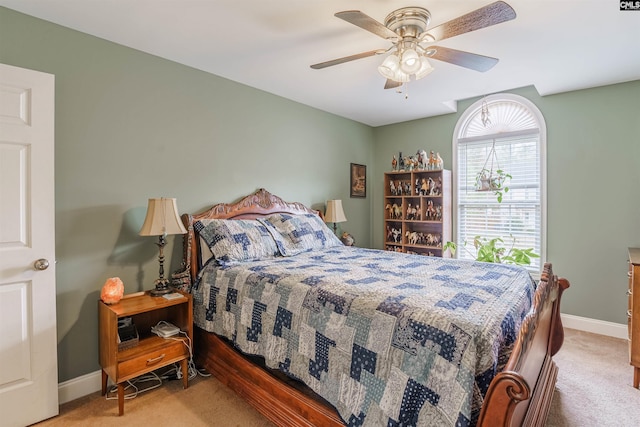 bedroom featuring ceiling fan and light colored carpet