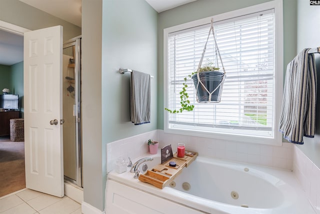 bathroom featuring tile flooring, shower with separate bathtub, and plenty of natural light