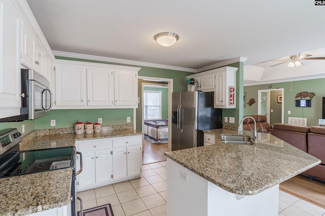 kitchen featuring ceiling fan, white cabinetry, appliances with stainless steel finishes, and crown molding