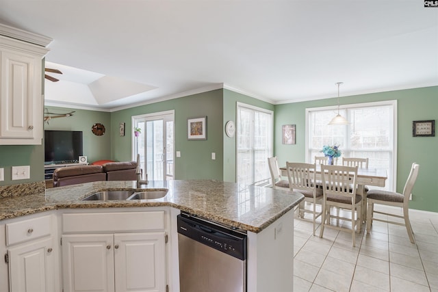 kitchen featuring sink, light tile floors, white cabinets, stainless steel dishwasher, and pendant lighting