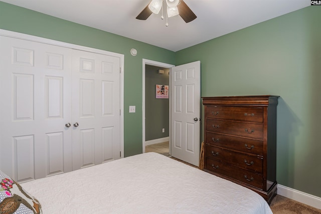 tiled bedroom with a closet and ceiling fan