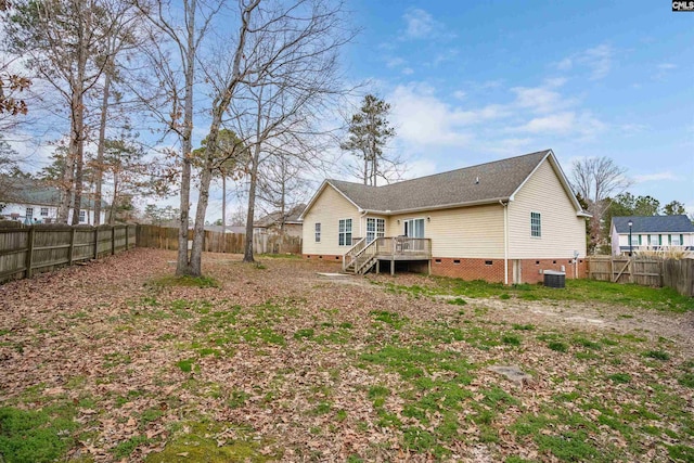 rear view of house featuring central AC unit and a deck