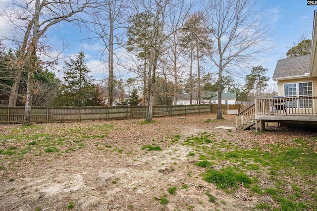 view of yard featuring a wooden deck