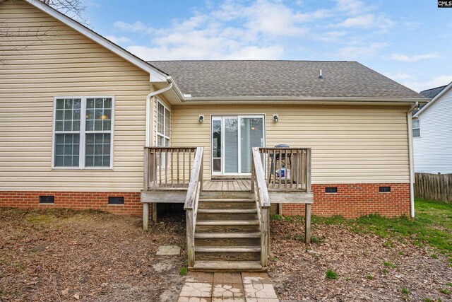 rear view of property with a deck