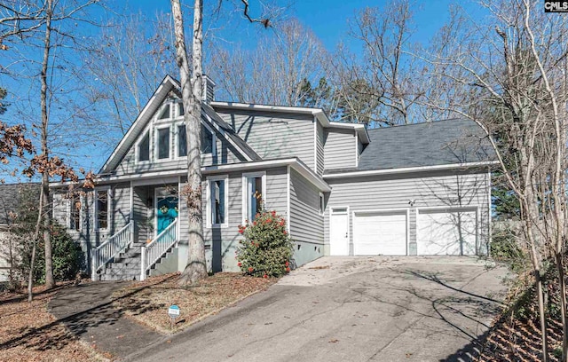 view of front of property with a porch and a garage