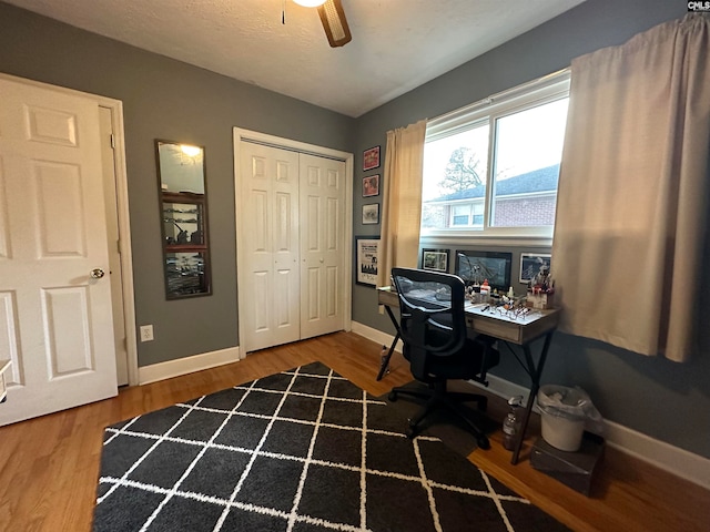 home office featuring ceiling fan and wood-type flooring