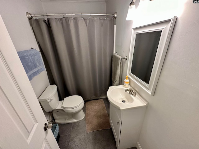 bathroom with vanity, tile floors, and toilet