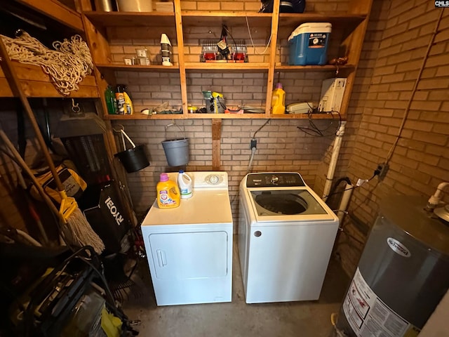 laundry area featuring washer and dryer and gas water heater