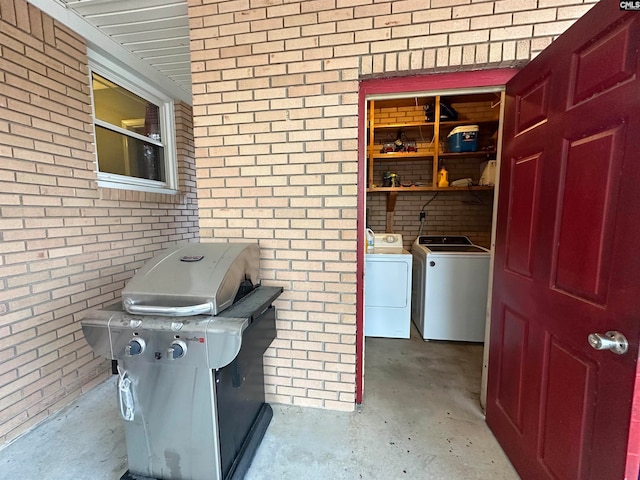 interior space with grilling area and washer and clothes dryer