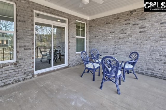 view of patio featuring ceiling fan