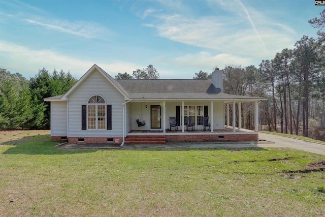 view of front of house with covered porch and a front lawn