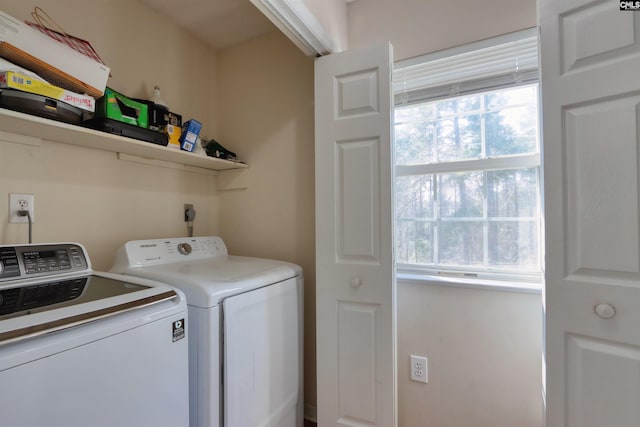 laundry area featuring electric dryer hookup and washing machine and dryer