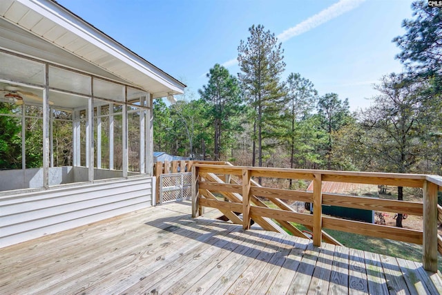 wooden deck featuring a sunroom