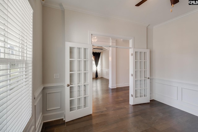 spare room with french doors, crown molding, dark wood-type flooring, and ceiling fan