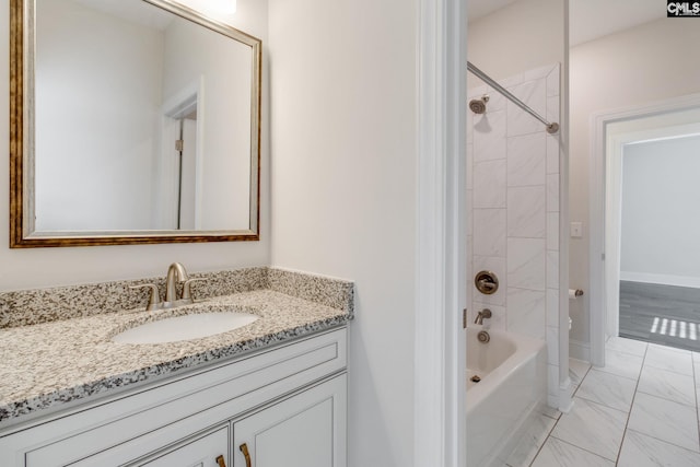 bathroom with tiled shower / bath, tile flooring, and vanity