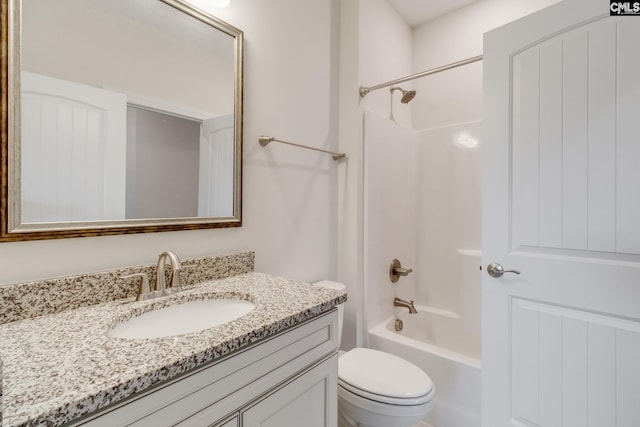 full bathroom with toilet, vanity, and washtub / shower combination