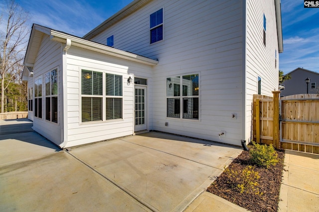 rear view of property featuring a patio area