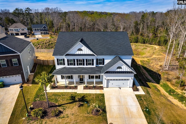 view of front facade featuring a front yard and a garage