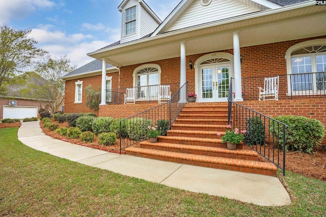 entrance to property featuring covered porch