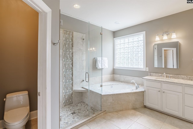 full bathroom featuring tile floors, toilet, independent shower and bath, and large vanity