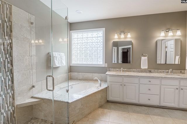 bathroom featuring separate shower and tub, double sink, tile floors, and oversized vanity