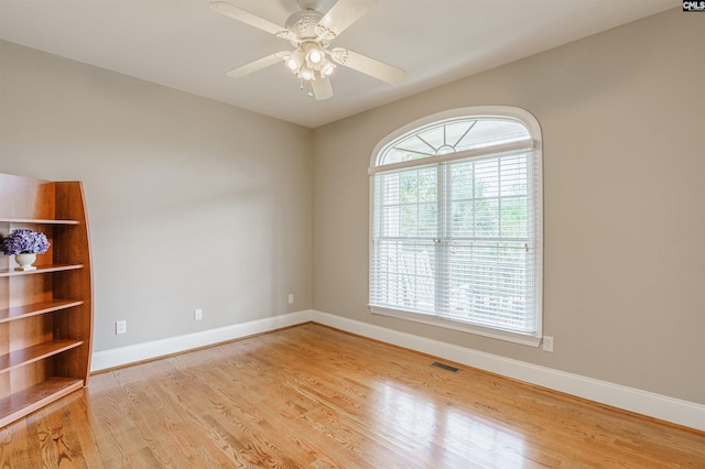 spare room featuring ceiling fan and light wood-type flooring