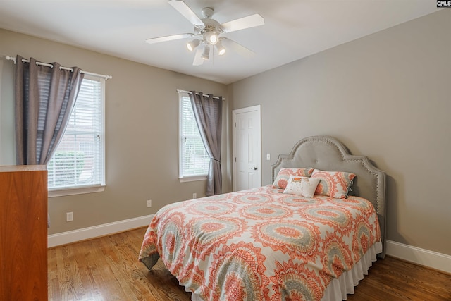 bedroom featuring hardwood / wood-style floors and ceiling fan