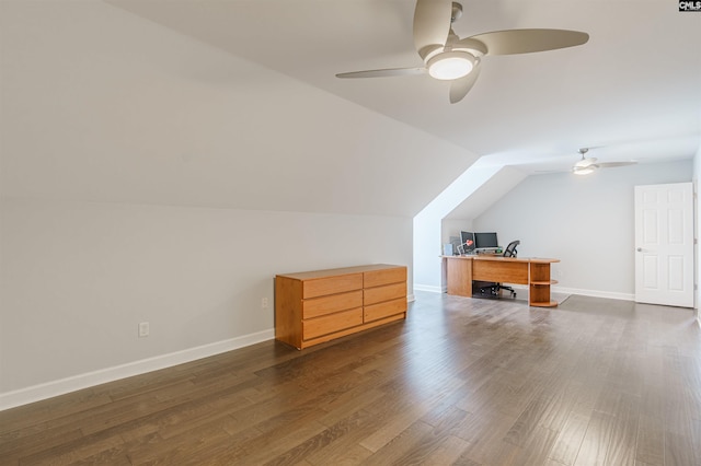 additional living space with dark wood-type flooring, ceiling fan, and vaulted ceiling