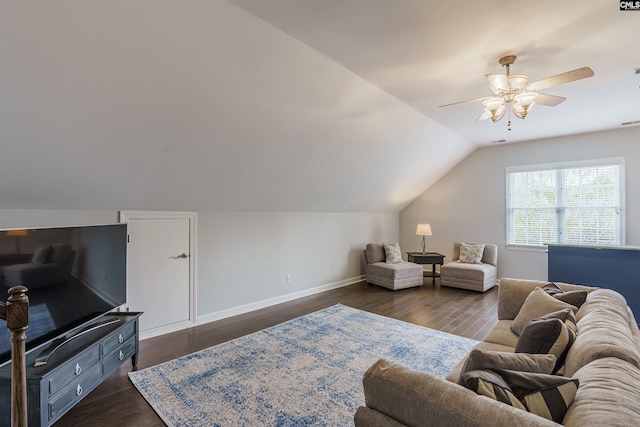 living room with dark hardwood / wood-style floors, ceiling fan, and vaulted ceiling