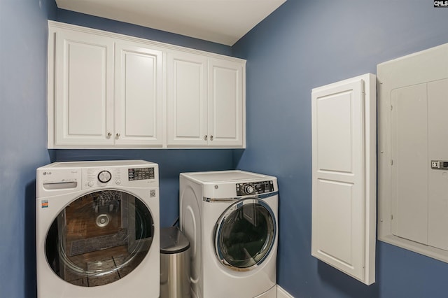 washroom featuring cabinets and separate washer and dryer