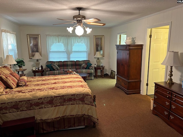 bedroom featuring ceiling fan, crown molding, dark carpet, and a textured ceiling