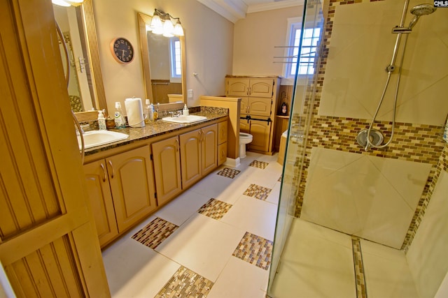 bathroom with double vanity, plenty of natural light, toilet, and tile floors