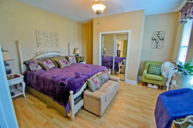 bedroom featuring a closet and light wood-type flooring