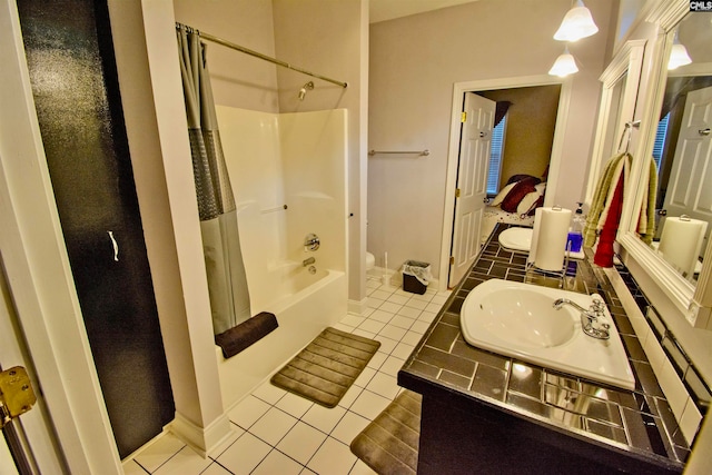 full bathroom featuring toilet, shower / bathing tub combination, sink, and tile flooring