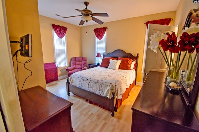 bedroom featuring light hardwood / wood-style flooring and ceiling fan