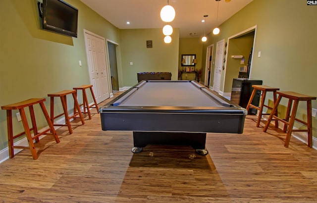 recreation room with light hardwood / wood-style flooring and pool table