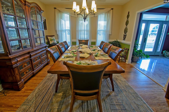 dining area with a chandelier and dark hardwood / wood-style floors