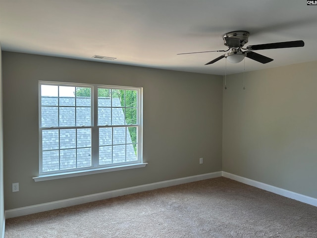 carpeted empty room with ceiling fan