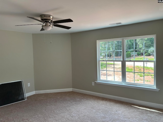 empty room featuring carpet and ceiling fan